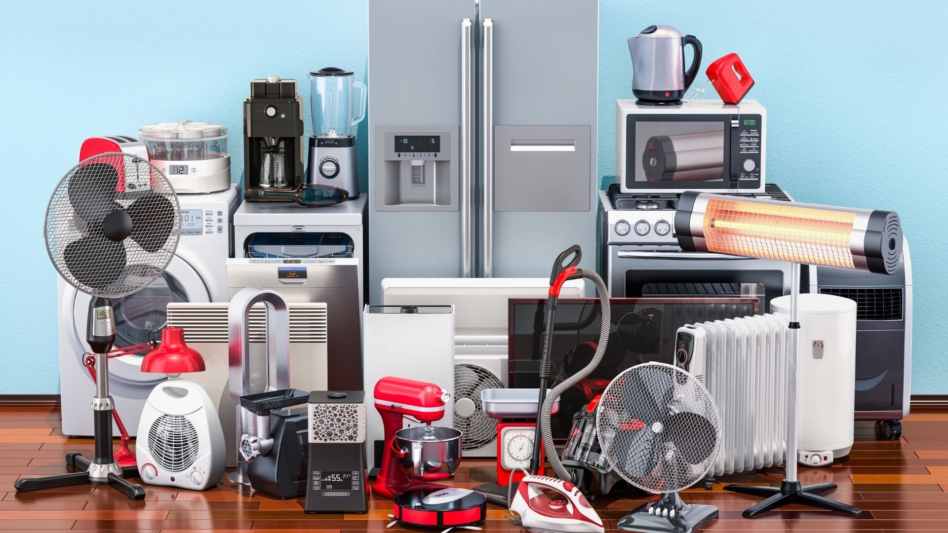 Collection of household appliances and electronic devices displayed on wooden floor against blue background.